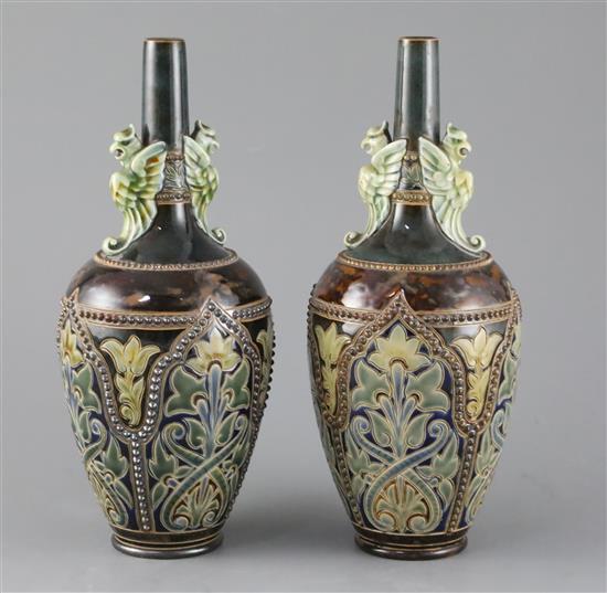 Frank A Butler for Doulton, a pair of Art Union of London bottle vases, c.1885, 24cm